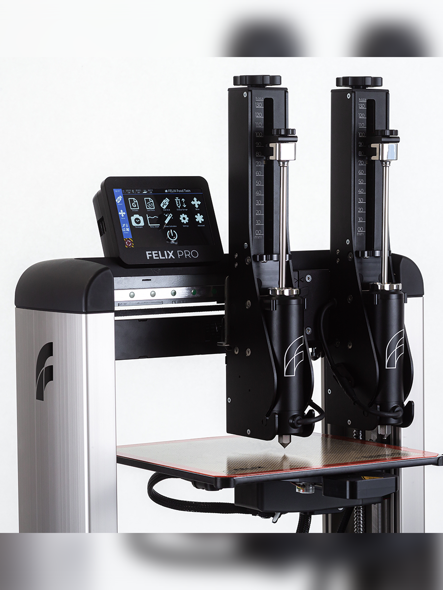 Close-up dual premium steel syringes in Felix TwinHead – durable cartridges for high-speed simultaneous food printing