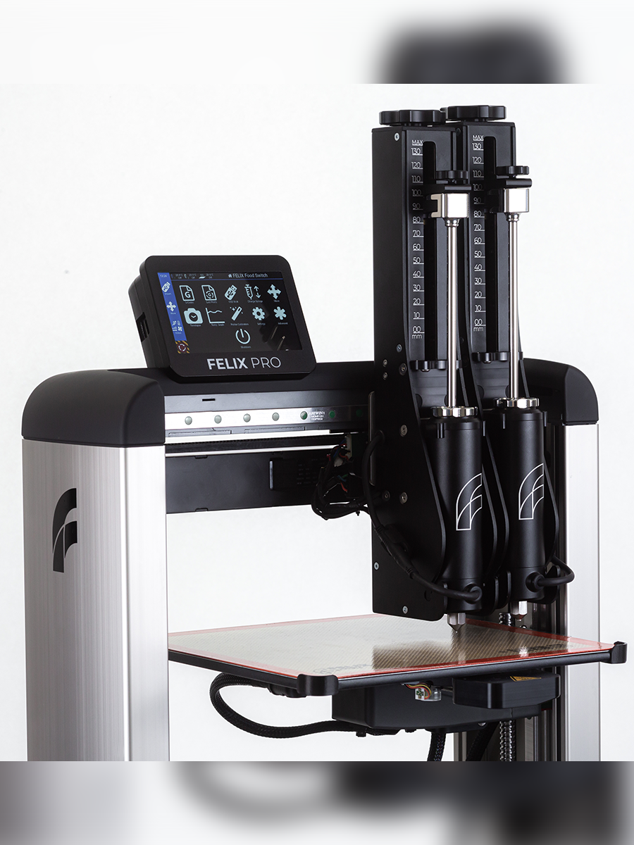 Close-up dual stainless-steel premium syringes in Felix Switch – durable, hygienic cartridges for 3D food printing